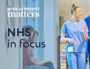 Healthcare staff walking through a hospital corridor wearing medical scrubs